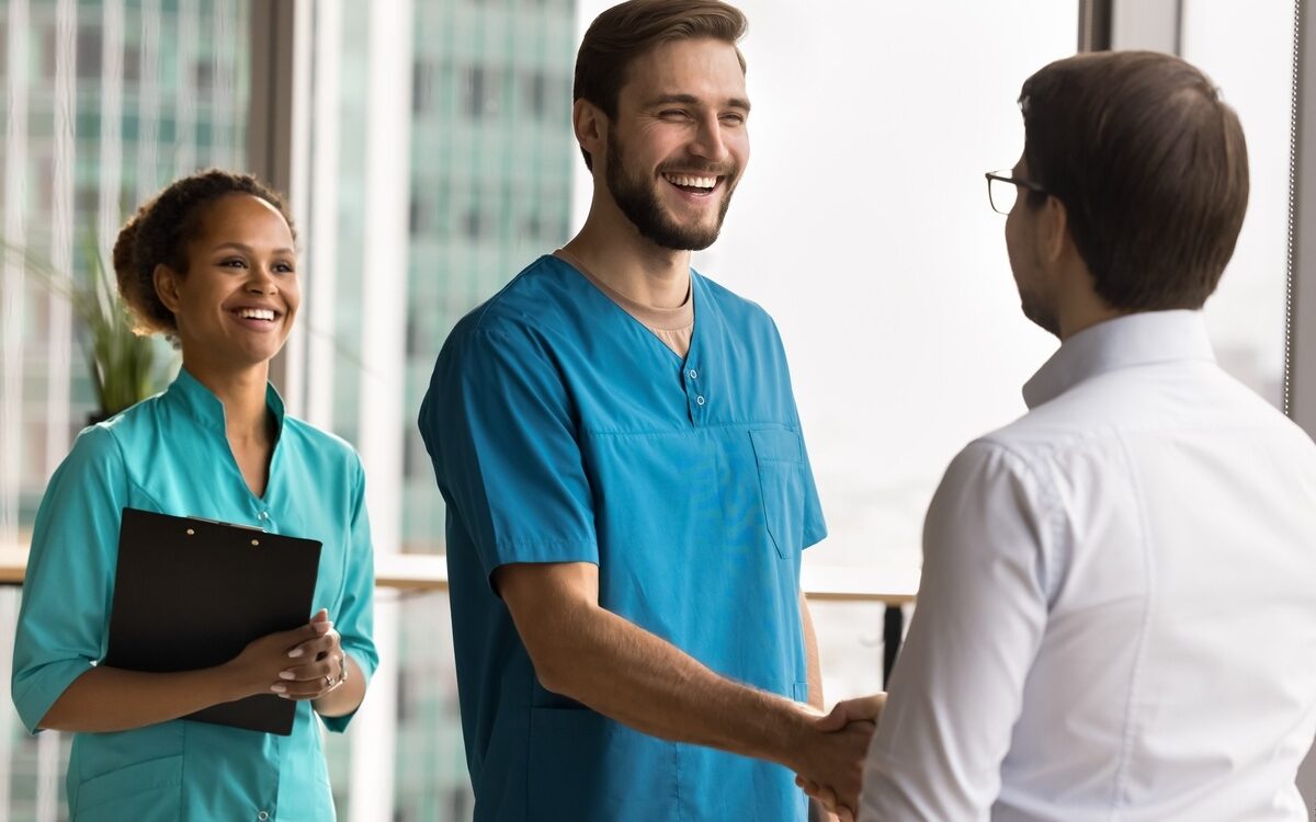 Healthcare provider explaining testosterone replacement therapy treatment process to male patient