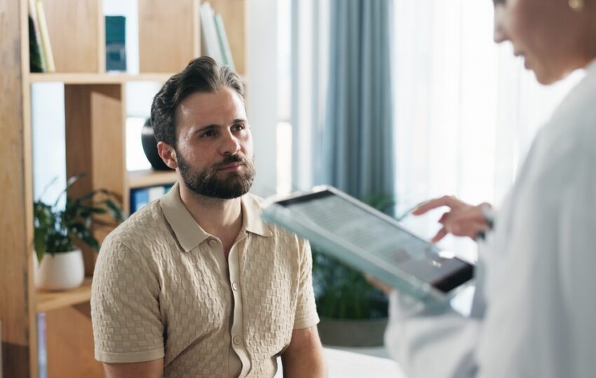 health care provider explaining testosterone replacement therapy side effects
